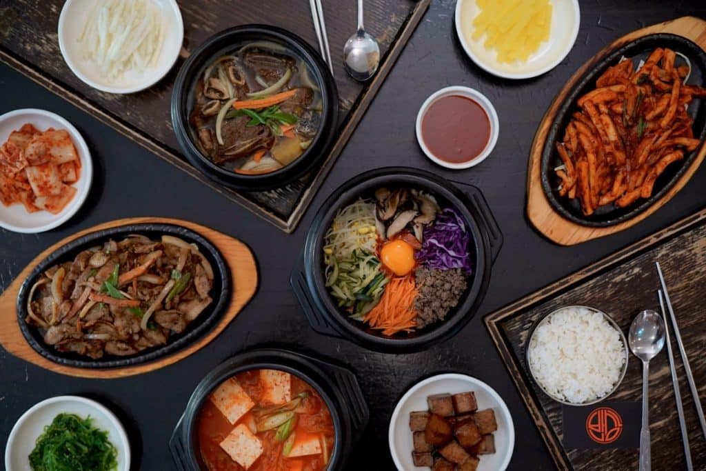A table of Korean dishes like bibimbap at BannSang Korean Restaurant