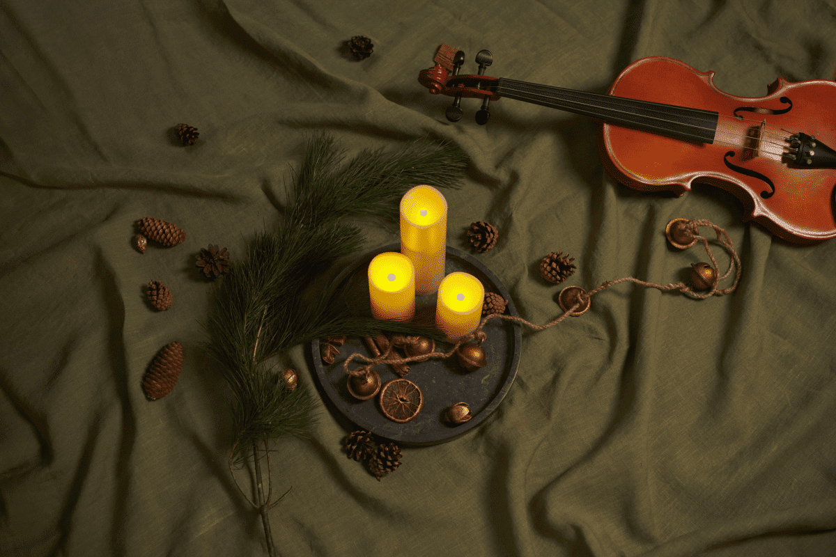 Candles, holly and a violin at a Candlelight concert